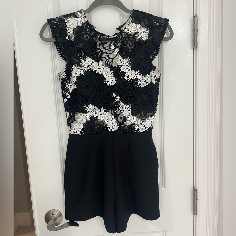 Black and white Karina Grimaldi romper with pockets. great condition xs